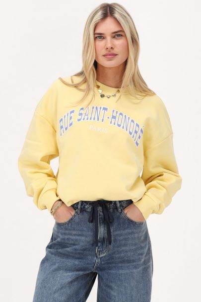 Gele sweater "Rue saint honoré"