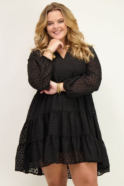 Wide-fitting black dress with V-neck