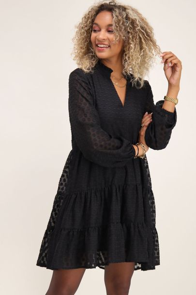 Wide-fitting black dress with V-neck