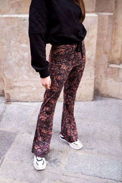 Black floral print flared trousers
