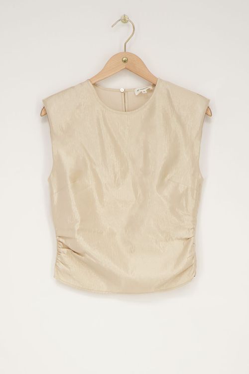 Beige shiny top with shoulder padding