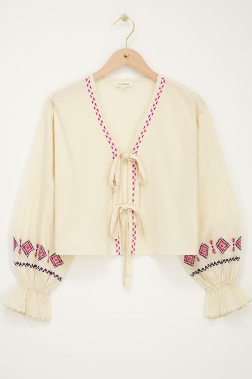 Beige top met strikjes & embroidery details
