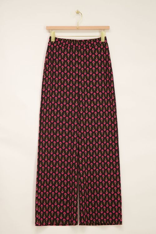 Schwarze Crinkle-Hose mit pinkem Ornamentmuster