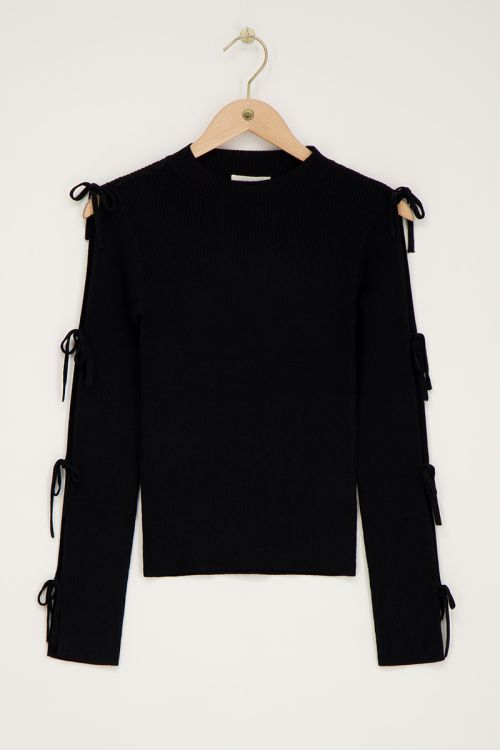 Black top with bows on sleeves