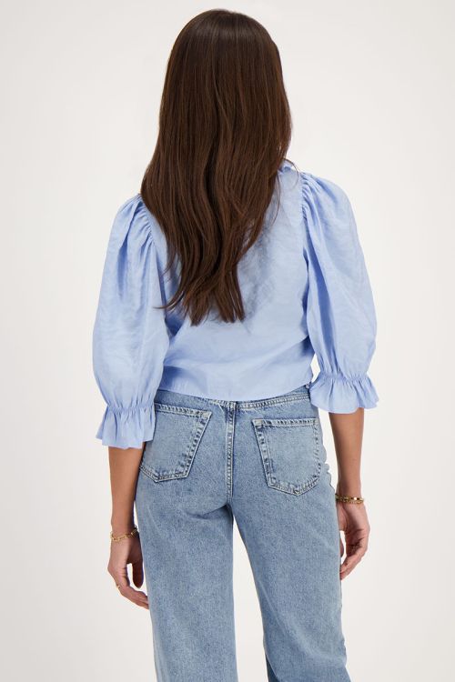 Blue top with bows and ruffled collar | My Jewellery