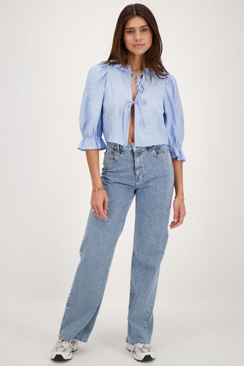 Blue top with bows and ruffled collar | My Jewellery