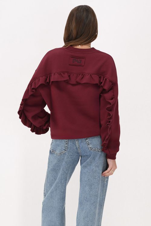 Dark red sweater with ruffle and patch