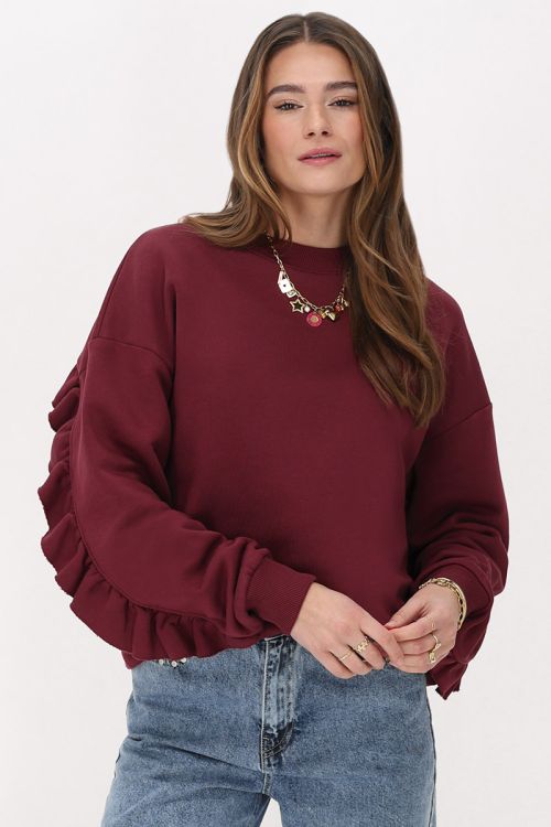 Dark red sweater with ruffle and patch