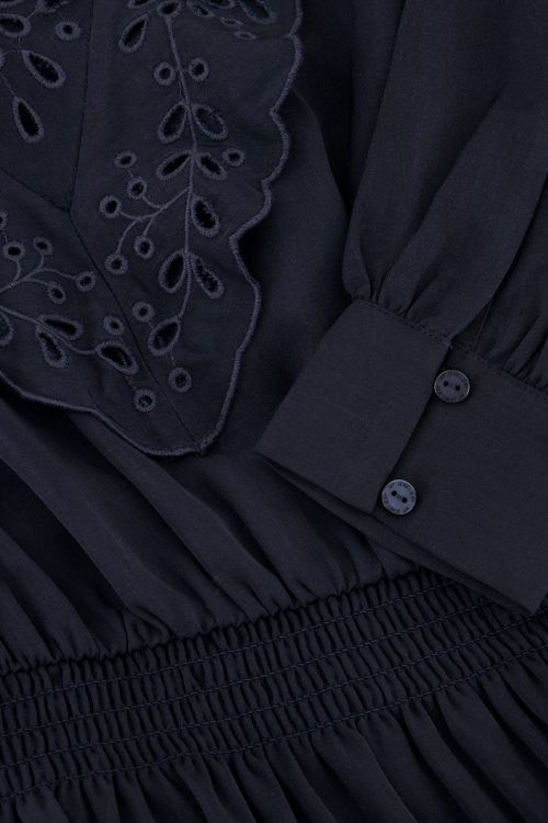 Dark blue dress with embroidery and ruffles