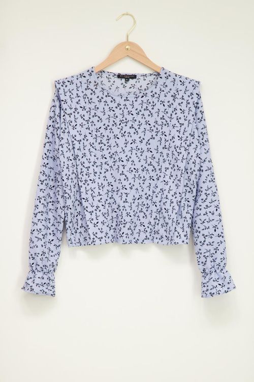 Blauwe blouse met bloempatroon in zwart