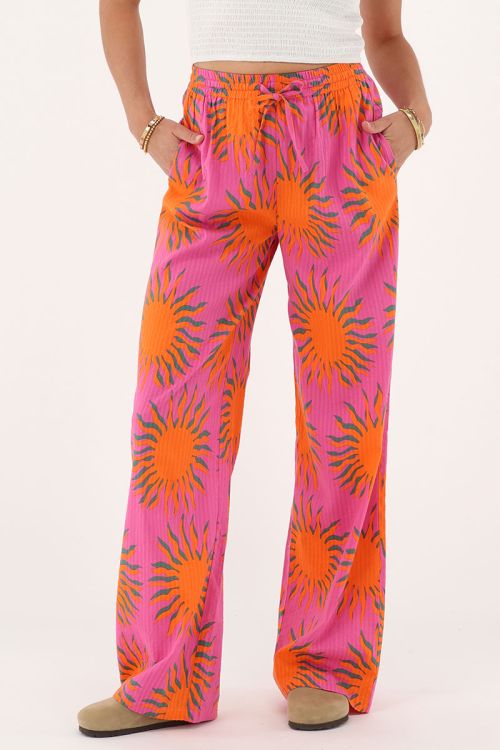 Pink wide leg trousers with sun print | My Jewellery