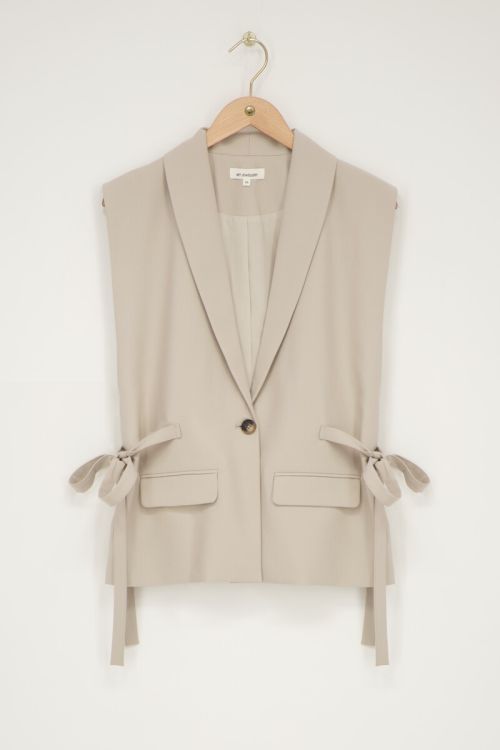 Beige gilet with bows