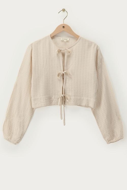Beige jacquard top with bow details