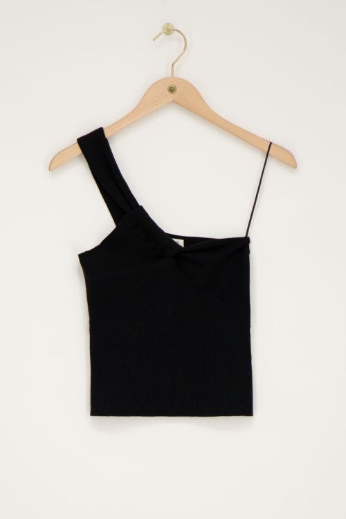 Top asymétrique noir avec effet torsadé