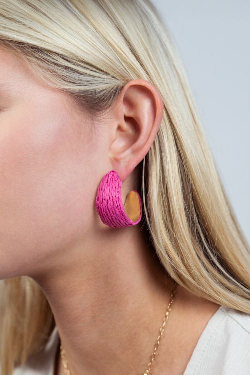 Wide hoop earrings with pink raffia