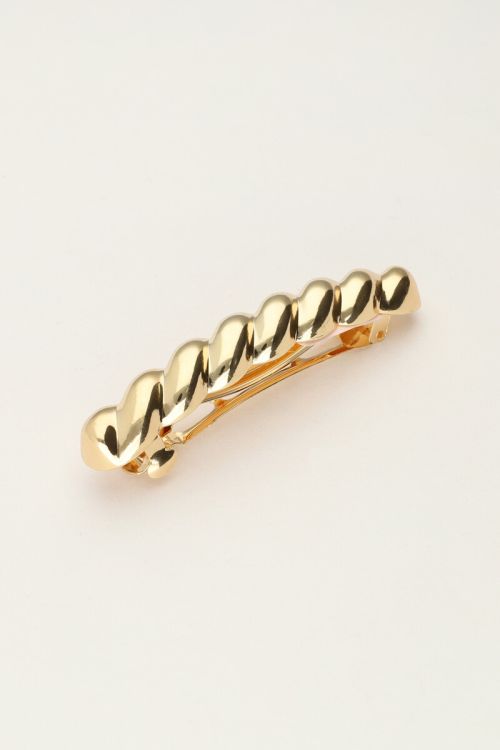 Gold coloured hair pin with twist