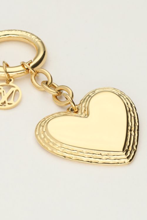 Goudkleurige bag charm met hartje