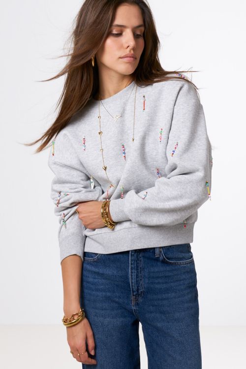 Light grey sweater with coloured beaded fringes | My Jewellery