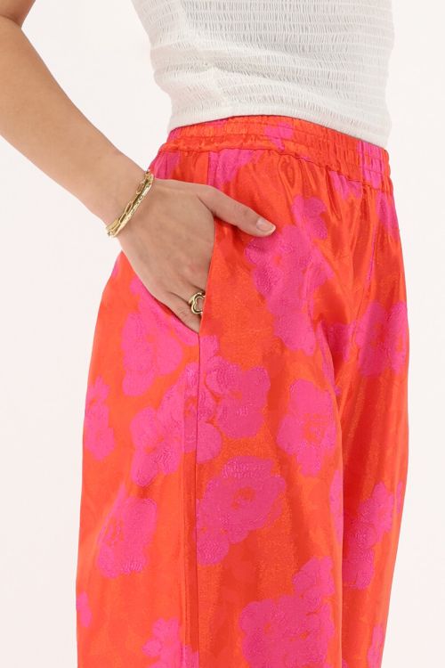 Orange jacquard wide leg trousers with pink flowers | My Jewellery