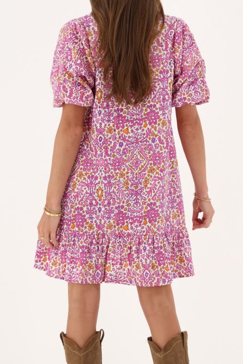 Pink dress with puff sleeves and ikat floral print