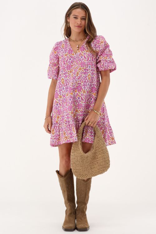 Pink dress with puff sleeves and ikat floral print