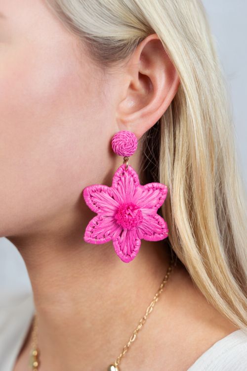 pink statement earrings with raffia flower