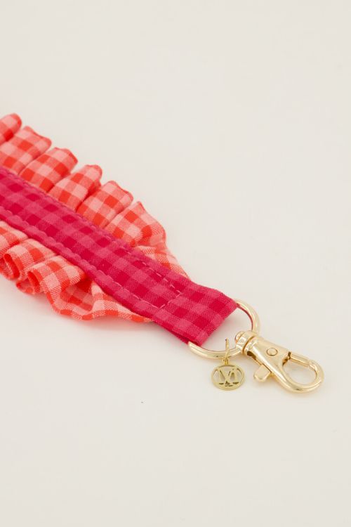 Pink phone cord with plaid