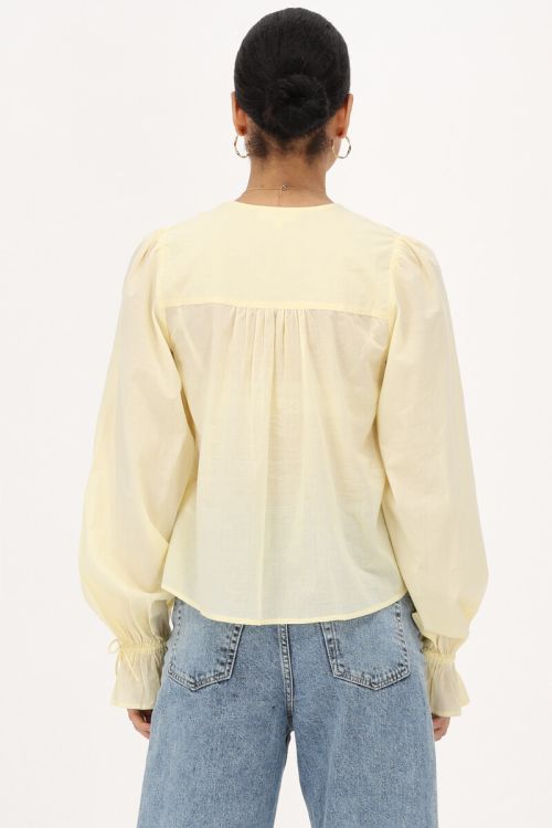 Yellow blouse with ruffles and bows