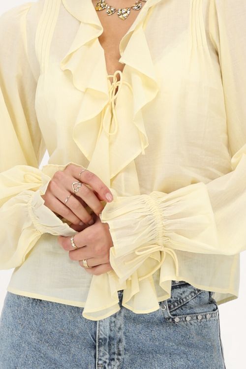 Yellow blouse with ruffles and bows