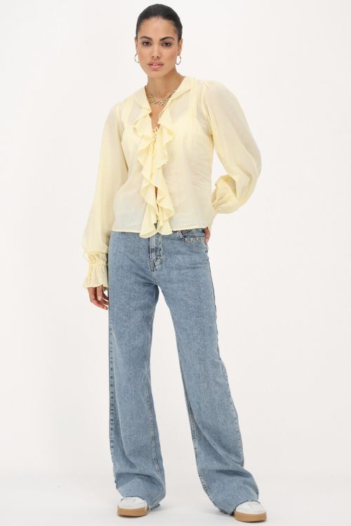 Yellow blouse with ruffles and bows
