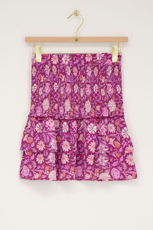 Lila Rock mit pinkem Blumenmuster und Smock