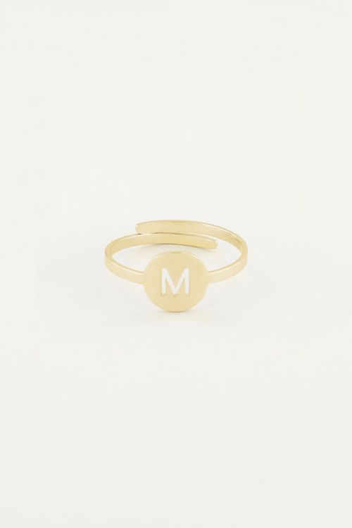 Gold coloured cut out initial ring