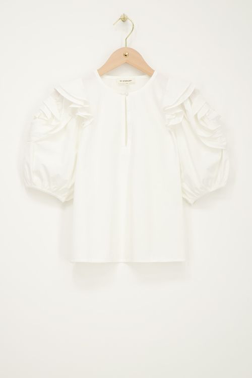 White top with flowers on sleeves