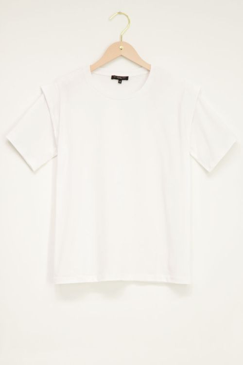 White top with shoulder pads