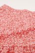 Rood rokje bloemenprint en optrek