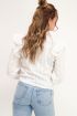 Witte blouse met doorlopende volants