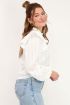 Witte blouse met doorlopende volants