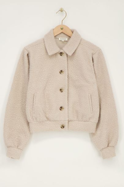 Beigefarbene Bouclé-Jacke