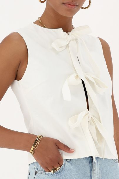 Beige gilet with chunky bows