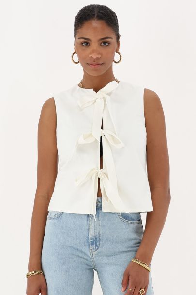 Beige gilet with chunky bows