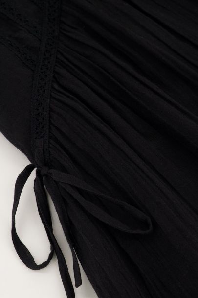 Black dress with tapes & ruffles