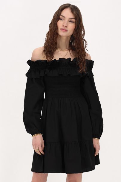 Zwarte jurk met ruffles & smock