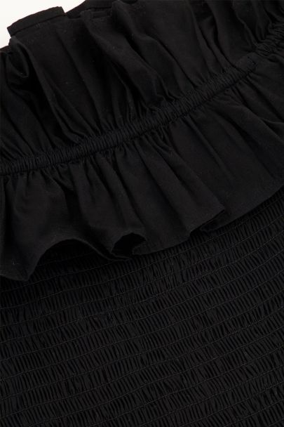 Zwarte gesmokte top met ruffles