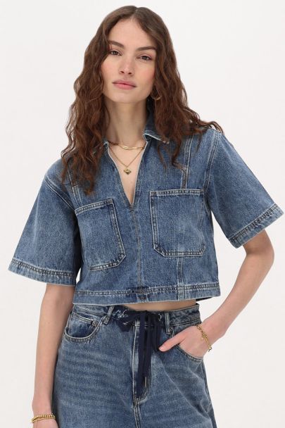 Blauwe denim top met V-hals