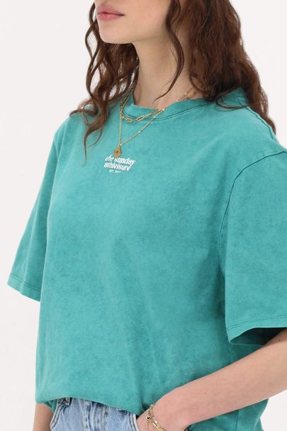 Green T-shirt sports and patches