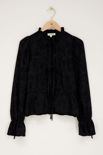 Zwarte jacquard top met strikjes en ruffle mouwen