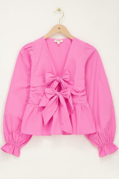 Pink top with bows & peplum