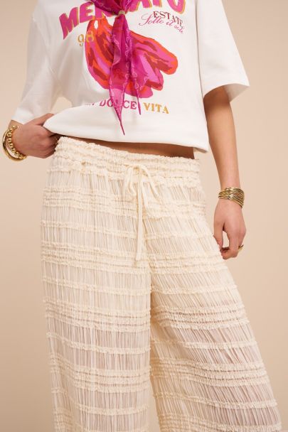 White wide leg trousers with ruffles