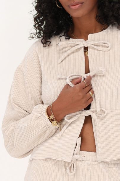 Beige corduroy top met strikjes