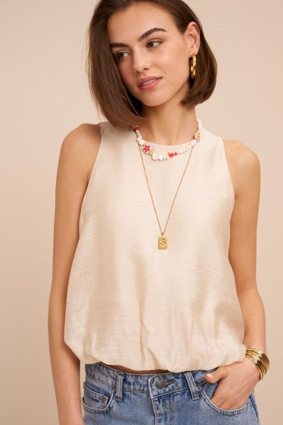 Beige mouwloze top in ballon look